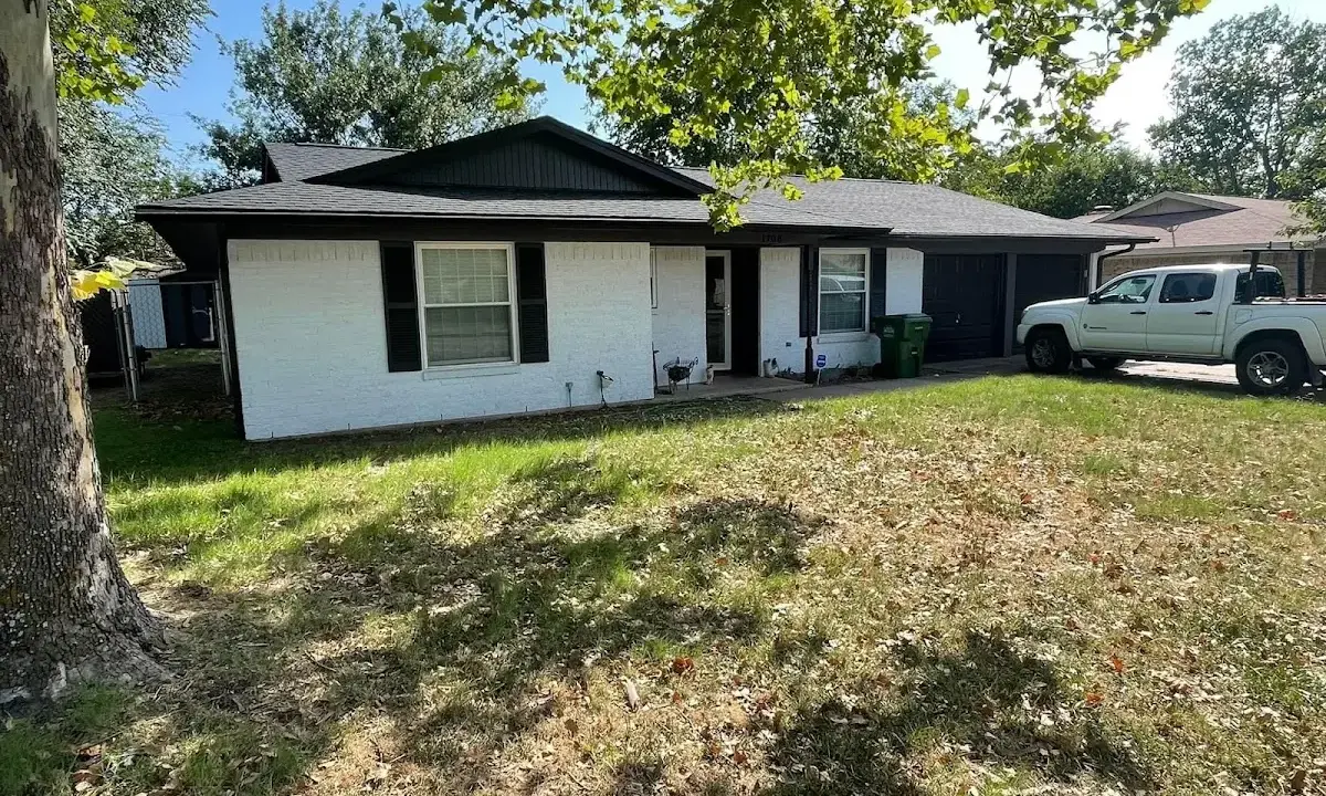 Professional roofing crew working on a residential roof in Grandwood Park